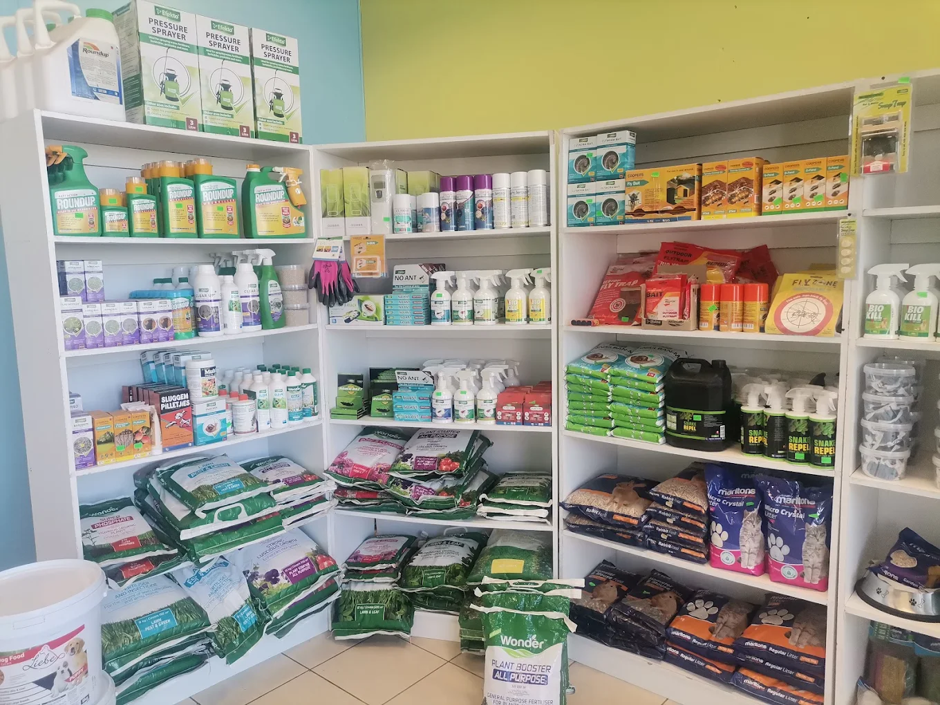 Inside Isac Pest Control's shop at Lemo Mall — shelves stocked with professional pest control products